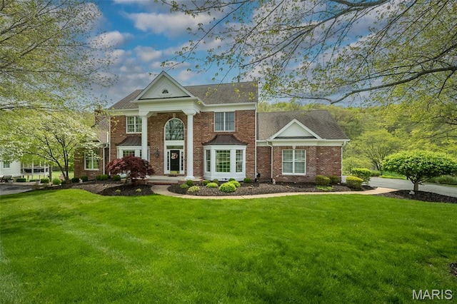 1417 Wheatfield Ln, Saint Albans, MO 63073 - neoclassical / greek revival house with a front lawn and brick siding