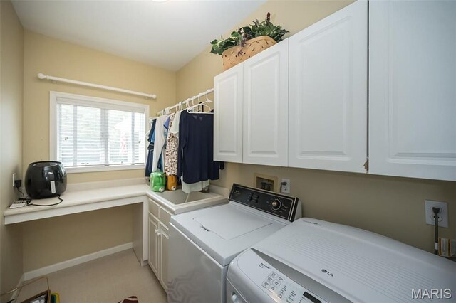 1417 Wheatfield Ln, Saint Albans, MO 63073 - laundry area featuring washer and dryer, cabinet space, and light carpet