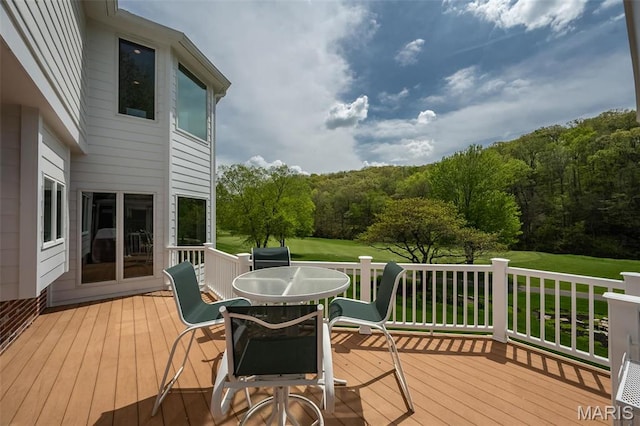 1417 Wheatfield Ln, Saint Albans, MO 63073 - wooden deck with outdoor dining area and a lawn