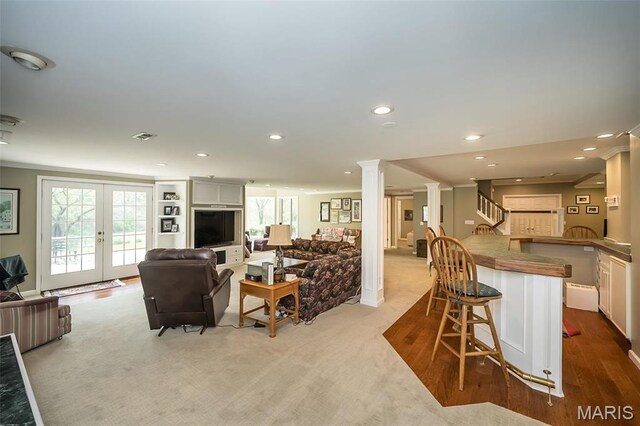 1417 Wheatfield Ln, Saint Albans, MO 63073 - living room with ornate columns, recessed lighting, light colored carpet, stairway, and french doors