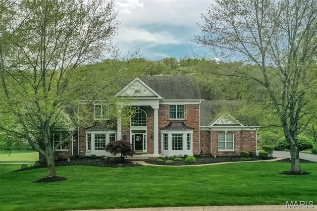 1417 Wheatfield Ln, Saint Albans, MO 63073 - view of front of home with a front lawn and brick siding