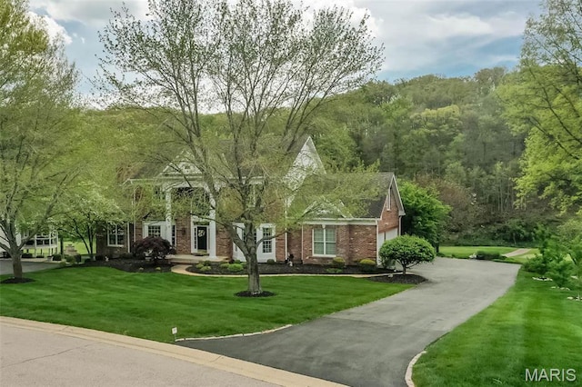 1417 Wheatfield Ln, Saint Albans, MO 63073 - view of front of home with a front yard and brick siding