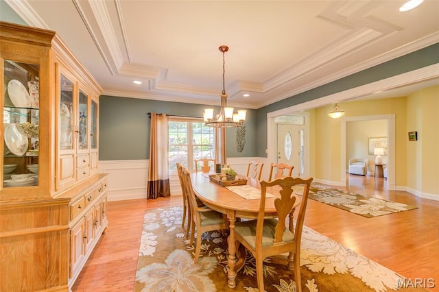4485 Killdeer Dr, Augusta, MO 63332 - dining area with a tray ceiling, ornamental molding, a chandelier, light wood-type flooring, and wainscoting