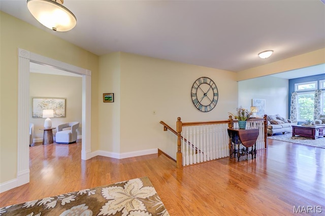 4485 Killdeer Dr, Augusta, MO 63332 - corridor with wood finished floors and an upstairs landing