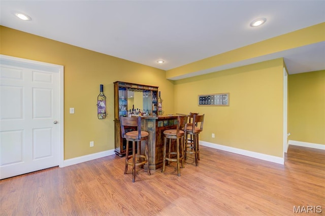 4485 Killdeer Dr, Augusta, MO 63332 - dining space with a dry bar, wood finished floors, and recessed lighting