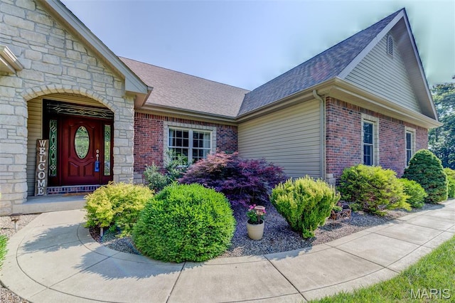 4485 Killdeer Dr, Augusta, MO 63332 - doorway to property with a shingled roof, stone siding, and brick siding