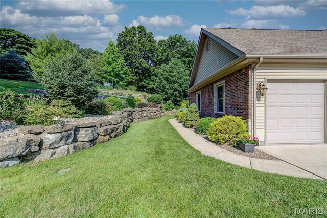 4485 Killdeer Dr, Augusta, MO 63332 - view of green lawn with a garage