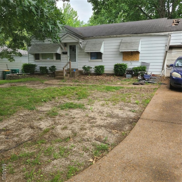 10519 Repose Dr, Bellefontaine Nghbrs, MO 63137 - view of front of home with a shingled roof