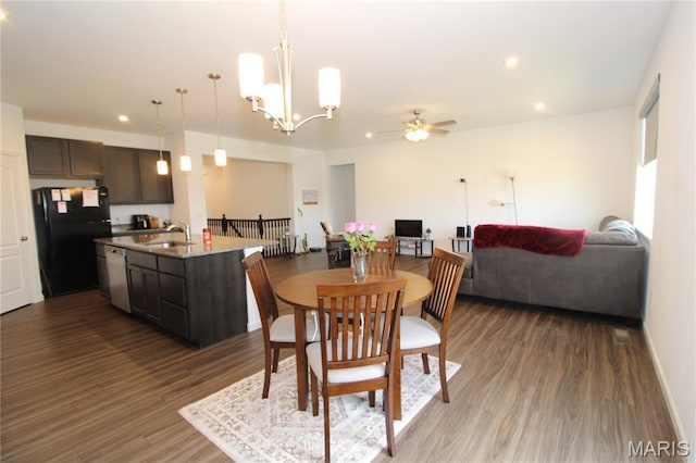 241 Dell View Dr, Arnold, MO 63010 - dining room with wood finished floors, a ceiling fan, a chandelier, and recessed lighting