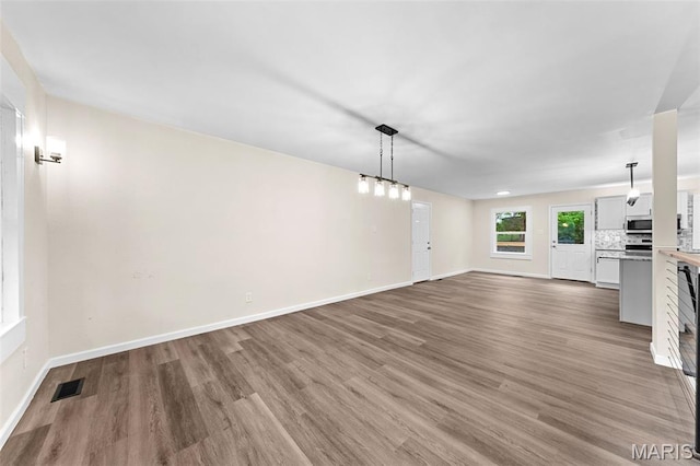 2019 San Pedro Dr, Arnold, MO 63010 - unfurnished living room featuring wood finished floors