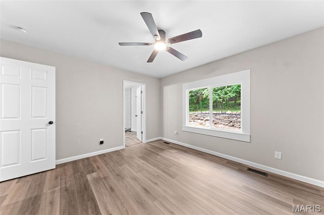 2019 San Pedro Dr, Arnold, MO 63010 - unfurnished bedroom featuring wood finished floors, ceiling fan, and ensuite bathroom