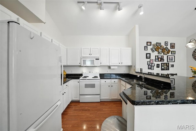 1275 Gardens Circle Drive E, Saint Louis, MO 63125 - kitchen featuring white appliances, a peninsula, dark wood-style flooring, and white cabinets