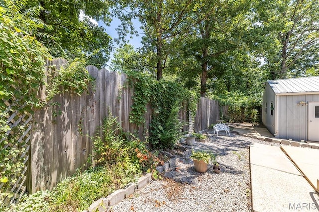 39 Rock Ridge Rd, Wappapello, MO 63966 - fenced backyard featuring an outbuilding and a patio area