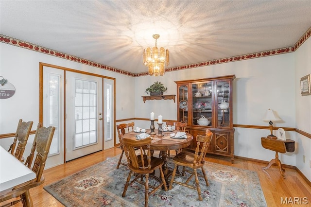 39 Rock Ridge Rd, Wappapello, MO 63966 - dining space featuring a chandelier and wood finished floors