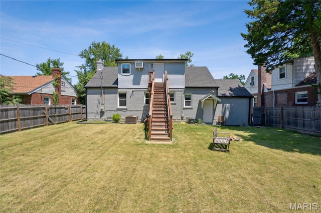 6838 Raymond Ave, Saint Louis, MO 63130 - rear view of house with stairway and a fenced backyard