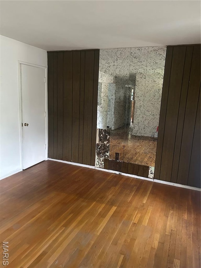 7250 Howdershell Rd, Hazelwood, MO 63042 - unfurnished room featuring hardwood / wood-style floors
