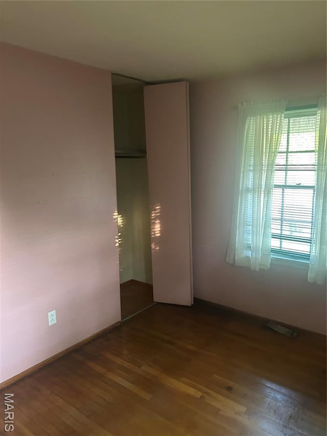 7250 Howdershell Rd, Hazelwood, MO 63042 - unfurnished room with dark wood-type flooring