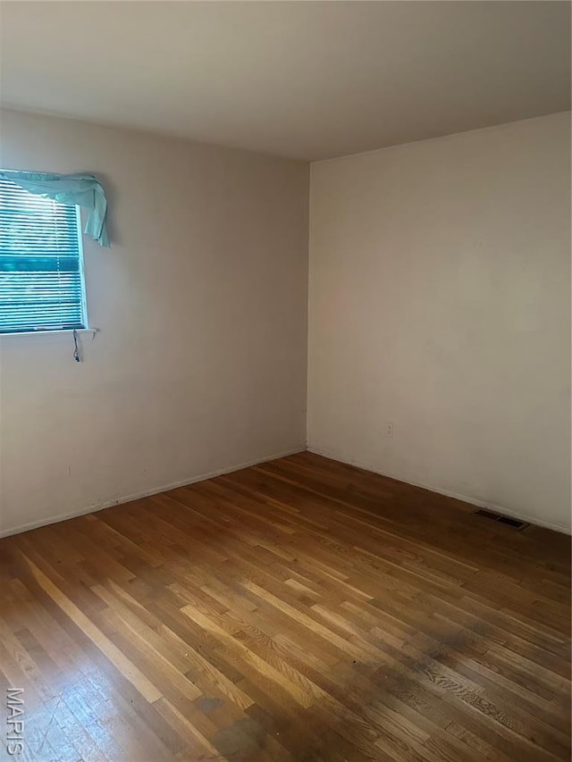 7250 Howdershell Rd, Hazelwood, MO 63042 - empty room with wood finished floors