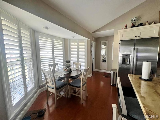 2302 Stonebrook, Dexter, MO 63841 - dining space featuring vaulted ceiling, dark wood-type flooring, and baseboards