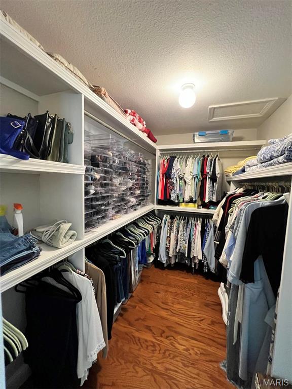 2302 Stonebrook, Dexter, MO 63841 - walk in closet with attic access and wood finished floors