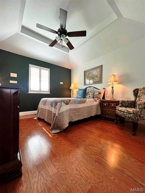 2302 Stonebrook, Dexter, MO 63841 - bedroom with a raised ceiling, dark wood-type flooring, ceiling fan, lofted ceiling, and baseboards