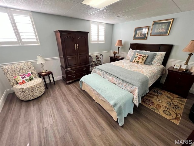 2302 Stonebrook, Dexter, MO 63841 - bedroom with wood finished floors, baseboards, and a drop ceiling