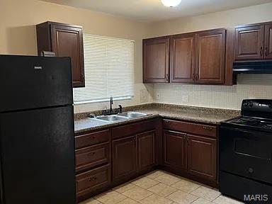 1217 Scott Ave, Saint Ferdinand Township, MO 63138 - kitchen featuring black appliances, dark countertops, ventilation hood, dark brown cabinetry, and light tile patterned floors
