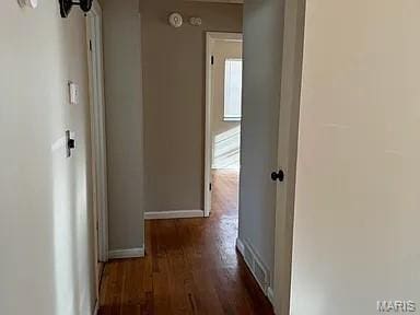 1217 Scott Ave, Saint Ferdinand Township, MO 63138 - hallway featuring dark wood-style floors and baseboards