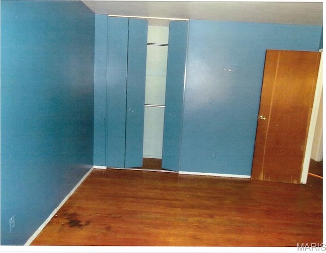 33 Potomac Dr, Fairview Heights, IL 62208 - spare room featuring wood finished floors and baseboards