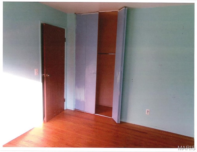 33 Potomac Dr, Fairview Heights, IL 62208 - unfurnished bedroom with wood finished floors and a closet
