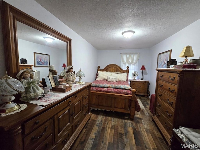 730 N Walnut St, Dexter, MO 63841 - bedroom featuring dark wood-type flooring and a textured ceiling