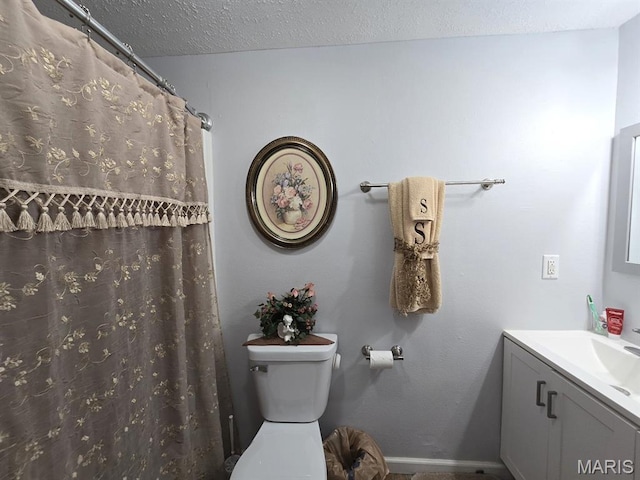 730 N Walnut St, Dexter, MO 63841 - full bathroom featuring vanity and a textured ceiling