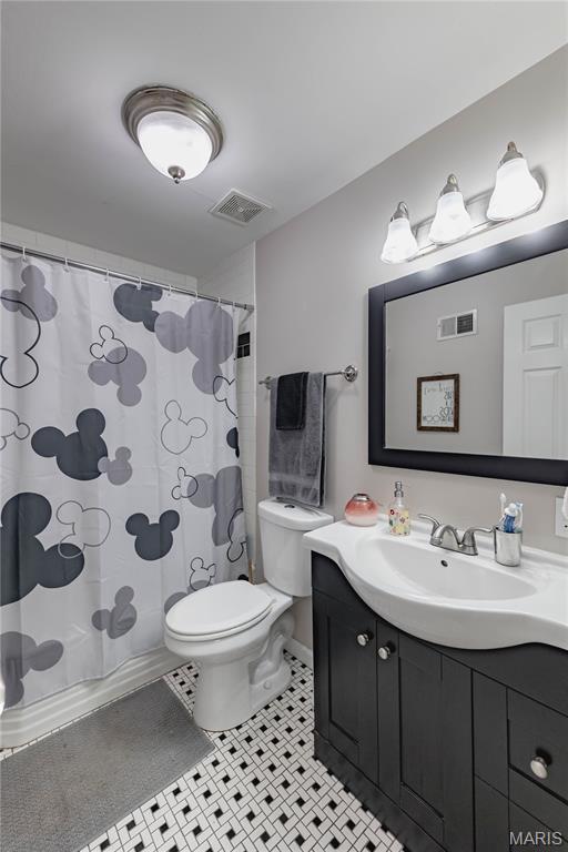 923 N Geyer Rd, Kirkwood, MO 63122 - full bathroom with vanity, tile patterned flooring, and a shower with curtain
