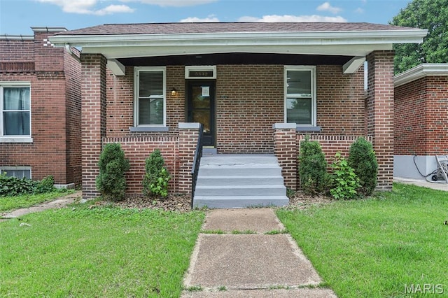 5532 Lansdowne Ave, Saint Louis, MO 63109 - view of exterior entry with brick siding and a lawn