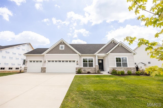 125 Chickasaw Ln, Ofallon, IL 62269 - craftsman-style house with stone siding, an attached garage, a front yard, and driveway