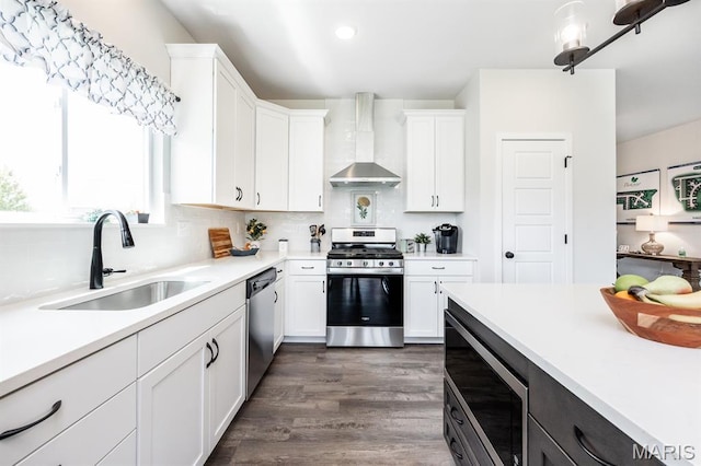 125 Chickasaw Ln, Ofallon, IL 62269 - kitchen featuring stainless steel appliances, wall chimney exhaust hood, light countertops, white cabinets, and recessed lighting