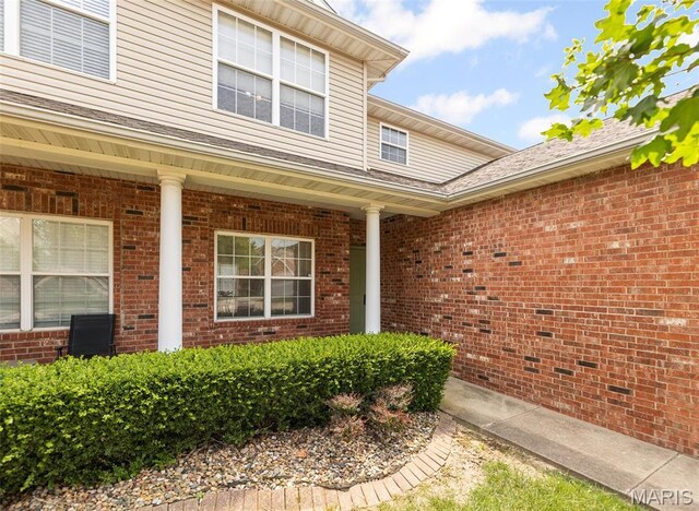 643 Titan Dr, Ofallon, IL 62269 - view of exterior entry featuring brick siding and covered porch