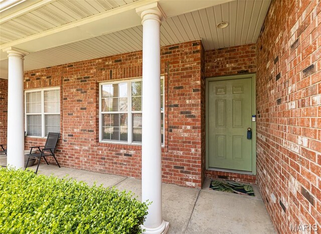 643 Titan Dr, Ofallon, IL 62269 - entrance to property featuring a porch and brick siding