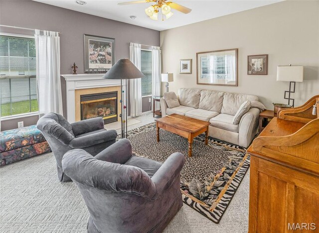 643 Titan Dr, Ofallon, IL 62269 - living area with carpet flooring, ceiling fan, and a fireplace with flush hearth