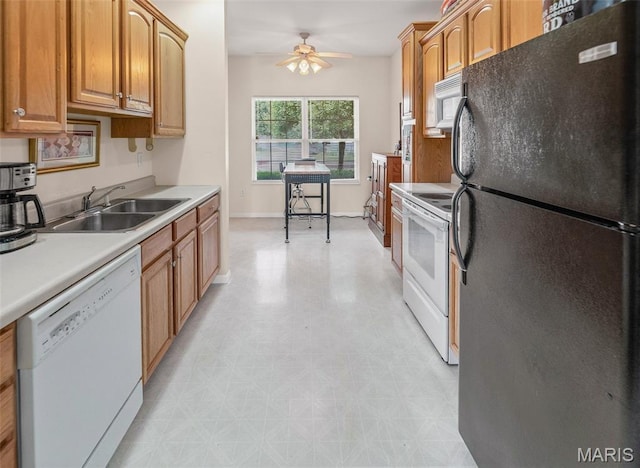 643 Titan Dr, Ofallon, IL 62269 - kitchen with white appliances, a ceiling fan, light countertops, light flooring, and brown cabinetry