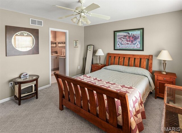 643 Titan Dr, Ofallon, IL 62269 - bedroom with light colored carpet, a ceiling fan, and ensuite bath