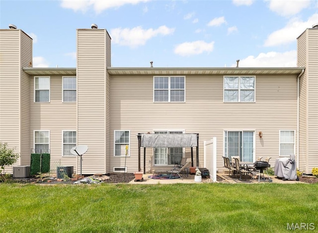 643 Titan Dr, Ofallon, IL 62269 - rear view of house featuring a patio, a lawn, a pergola, and a chimney