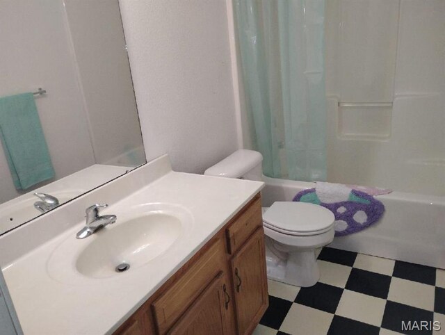 643 Titan Dr, Ofallon, IL 62269 - bathroom featuring tile patterned floors, vanity, and shower / bath combo with shower curtain