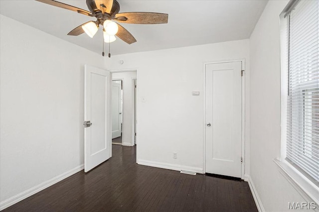 8505 Church Bell Ln, Jennings, MO 63136 - unfurnished bedroom with dark wood-style floors and a ceiling fan