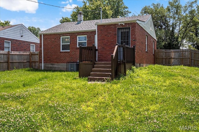8505 Church Bell Ln, Jennings, MO 63136 - back of property with brick siding, a chimney, and roof with shingles