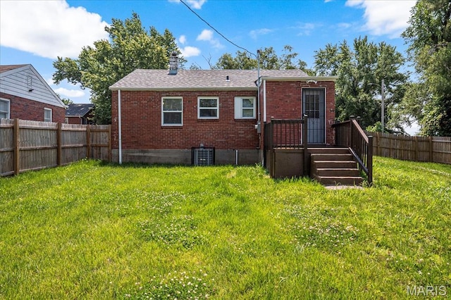 8505 Church Bell Ln, Jennings, MO 63136 - rear view of property with brick siding, a fenced backyard, and a chimney