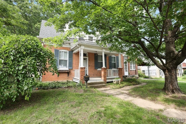 503 E State St, Union, MO 63084 - view of front of house with a porch, brick siding, a shingled roof, and a front lawn