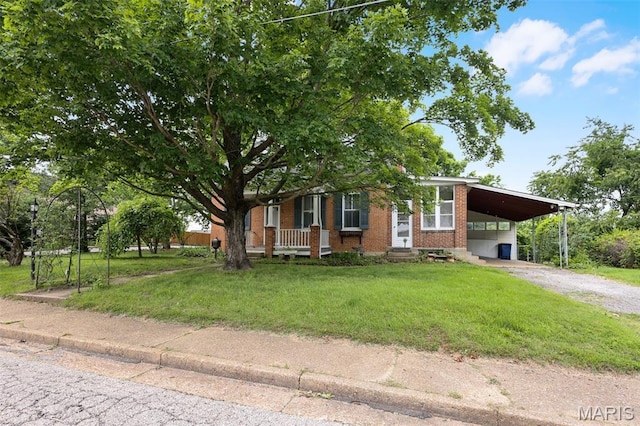 503 E State St, Union, MO 63084 - obstructed view of property featuring brick siding, a front yard, a carport, and driveway