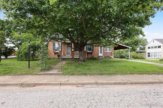503 E State St, Union, MO 63084 - obstructed view of property with a front lawn, a carport, brick siding, and covered porch