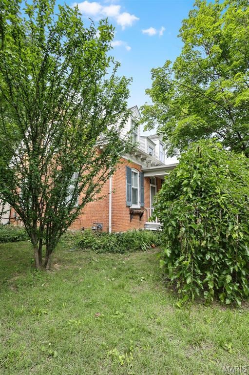 503 E State St, Union, MO 63084 - view of home's exterior with brick siding and a yard